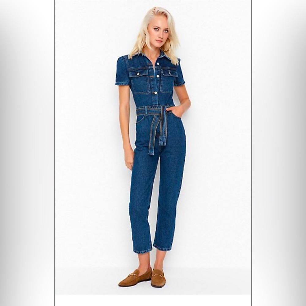 Brand new denim jumpsuit tags still attached.